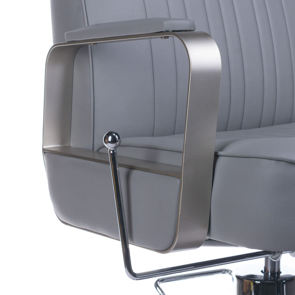Light gray barber chair by Beauty System, model HOMER BH-31237, with adjustable armrests and padded seat for professional salon use.