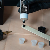 Unistar Cup Ink Glue 50g in a small white cup, showing the adhesive texture for crafting and bonding applications.